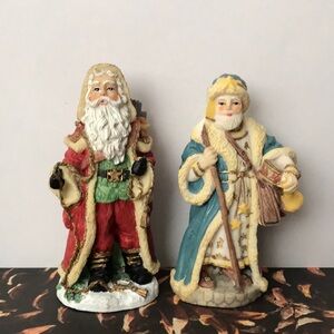 2 International Santa Claus collection figurines